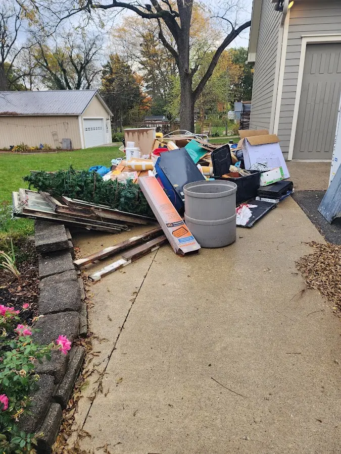 Dumpster being loaded with debris for 30 Yard Dumpster Rental in Hidalgo